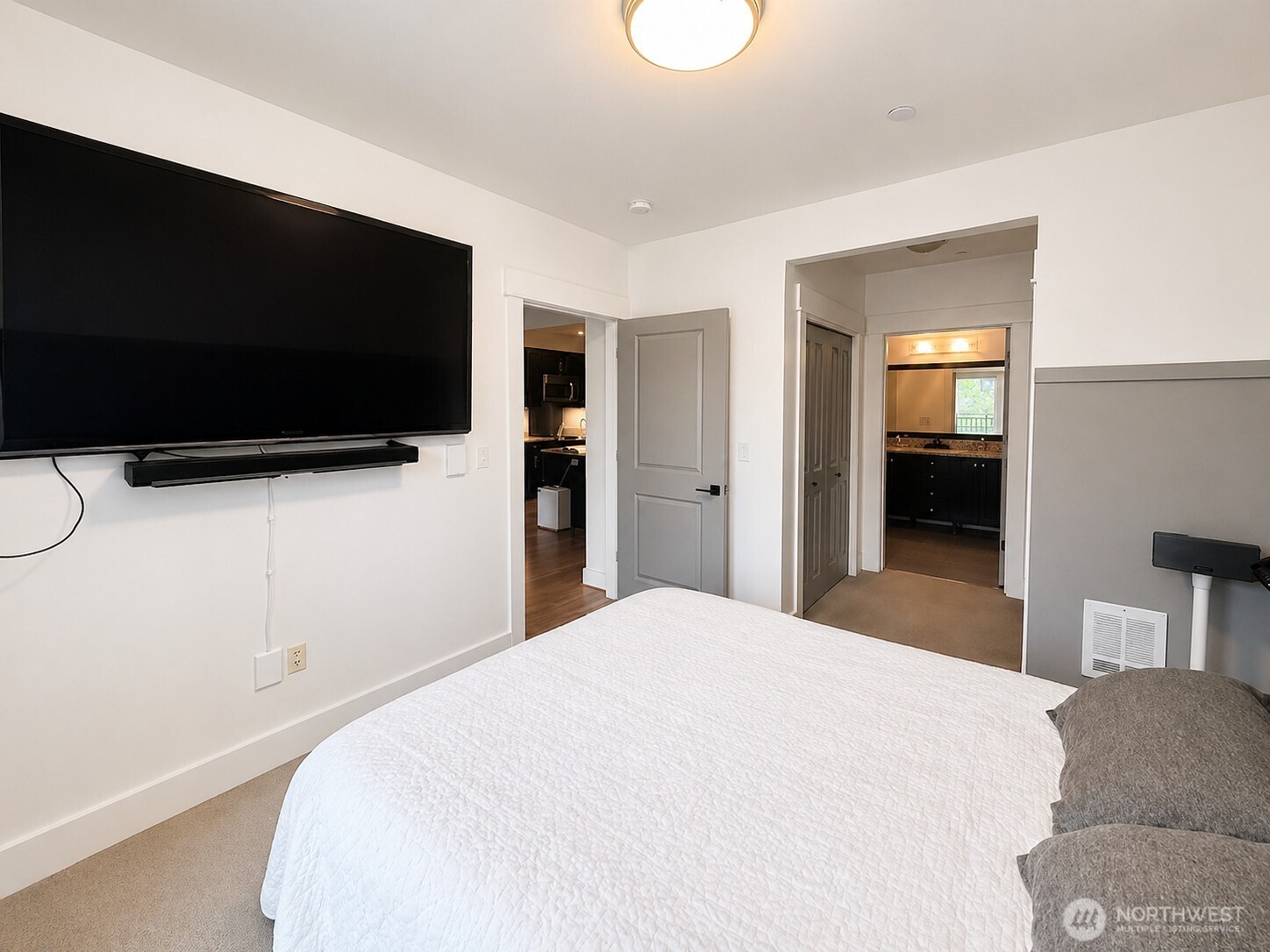 699 John Street, Unit 515 Seattle, WA 98109 - Photo 14 of 26 a bedroom with a bed and a flat screen tv