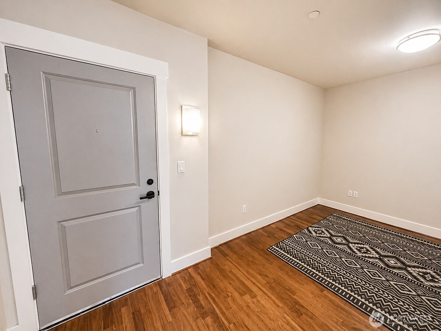 699 John Street, Unit 515 Seattle, WA 98109 - Photo 2 of 26 a view of a room with wooden floor and closet