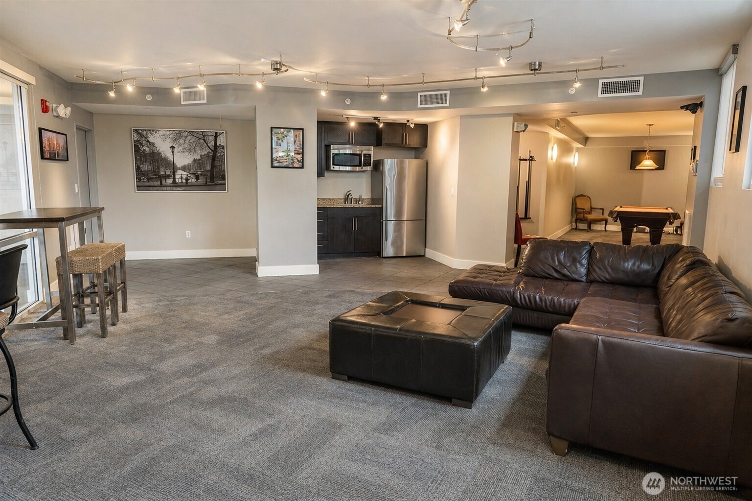 699 John Street, Unit 515 Seattle, WA 98109 - Photo 23 of 26 a living room with furniture and a chandelier