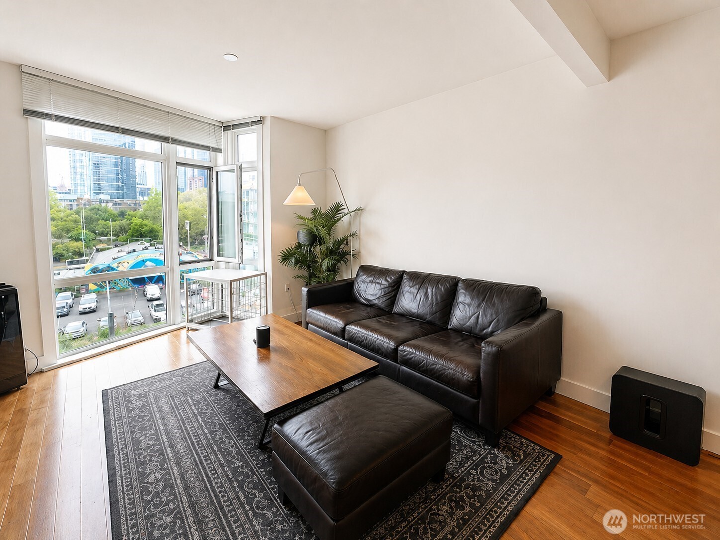 699 John Street, Unit 515 Seattle, WA 98109 - Photo 10 of 26 a living room with furniture and a window