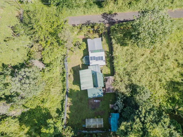 a aerial view of a house with a yard