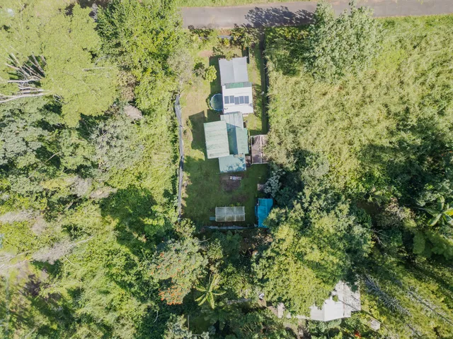 a aerial view of a house with a yard