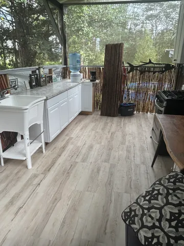 an aerial view of a house with garden space and street view