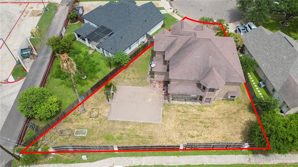 2001 Quail Lane Mission, TX 78572 - Photo 25 of 28 Aerial overview showcasing a two-story brick residence with an expansive backyard