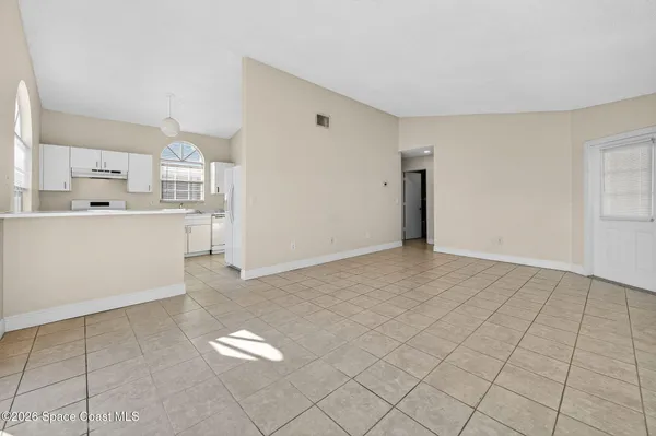 a view of an empty room and window