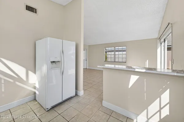 a kitchen with a stove a sink and a refrigerator