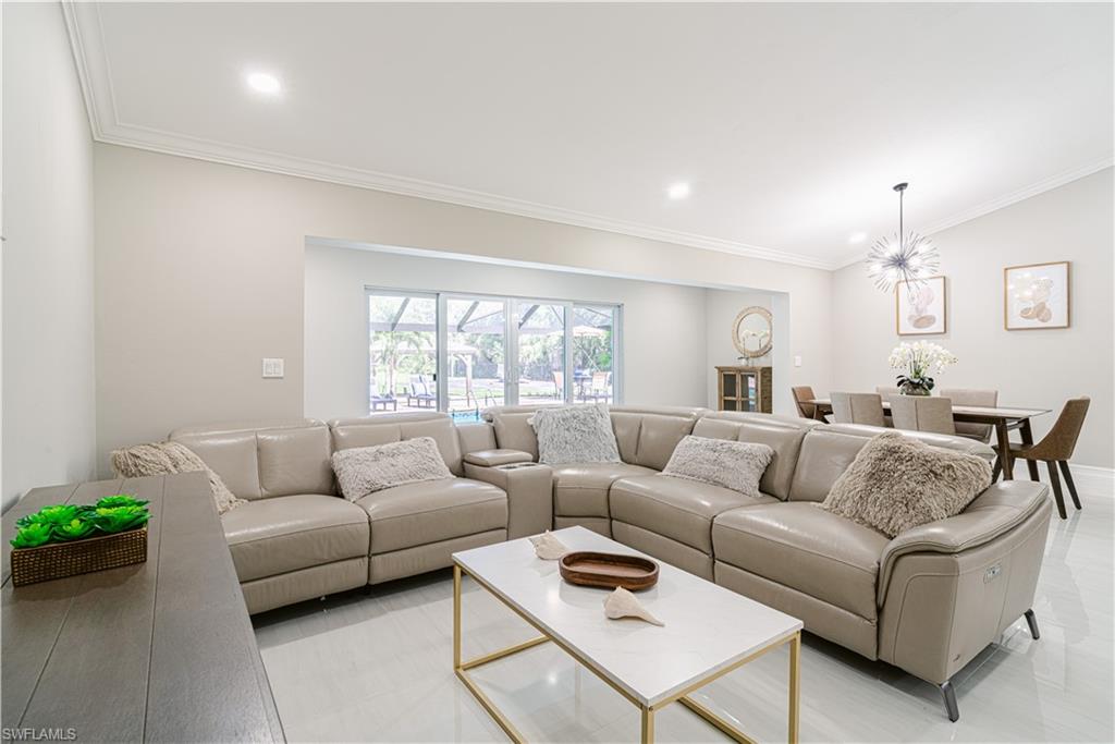 131 25th Street Southwest Naples, FL 34117 - Photo 21 of 50 a living room with furniture and a large window