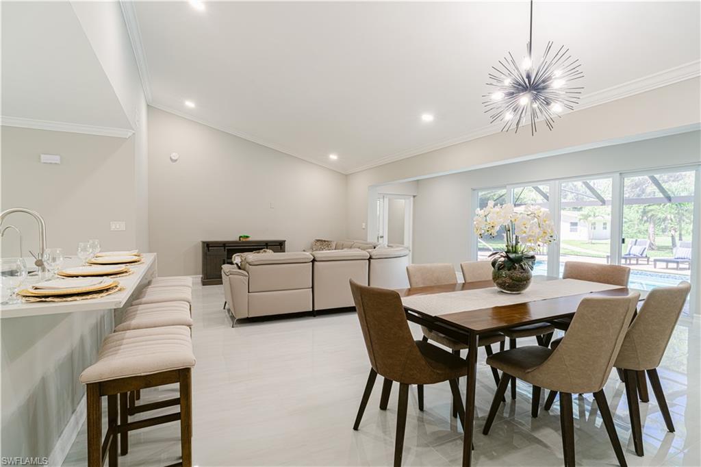 131 25th Street Southwest Naples, FL 34117 - Photo 22 of 50 a view of a dining room with furniture and window
