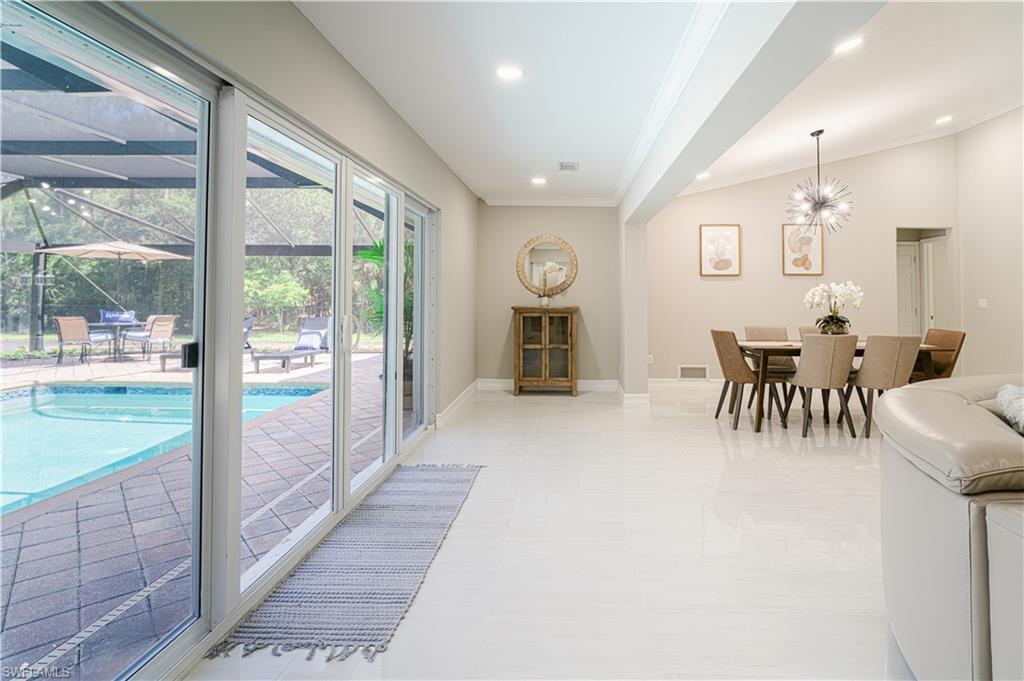 131 25th Street Southwest Naples, FL 34117 - Photo 23 of 50 a view of a dining room with furniture window and outside view