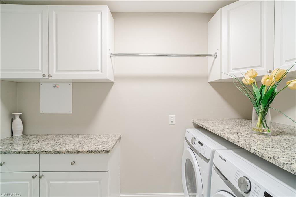 131 25th Street Southwest Naples, FL 34117 - Photo 45 of 50 a bathroom with a granite countertop sink a mirror and vanity