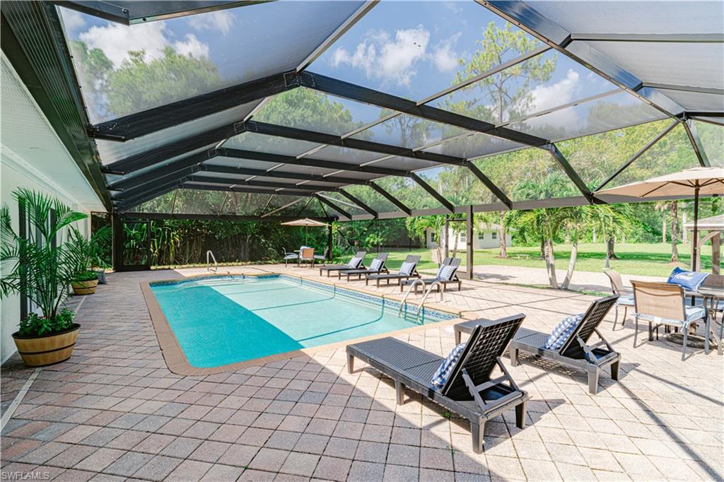 131 25th Street Southwest Naples, FL 34117 - Photo 49 of 50 a view of a swimming pool with a patio