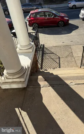 a view of a city street with cars