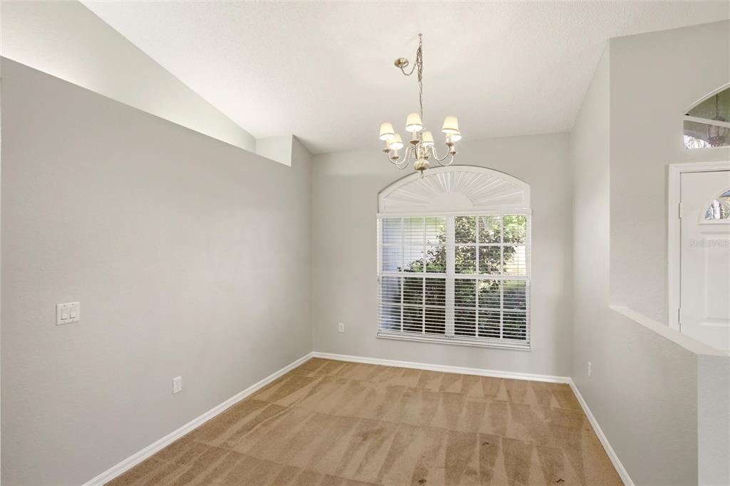24644 Laurel Ridge Drive Lutz, FL 33559 - Photo 13 of 42 wooden floor in an empty room with a window