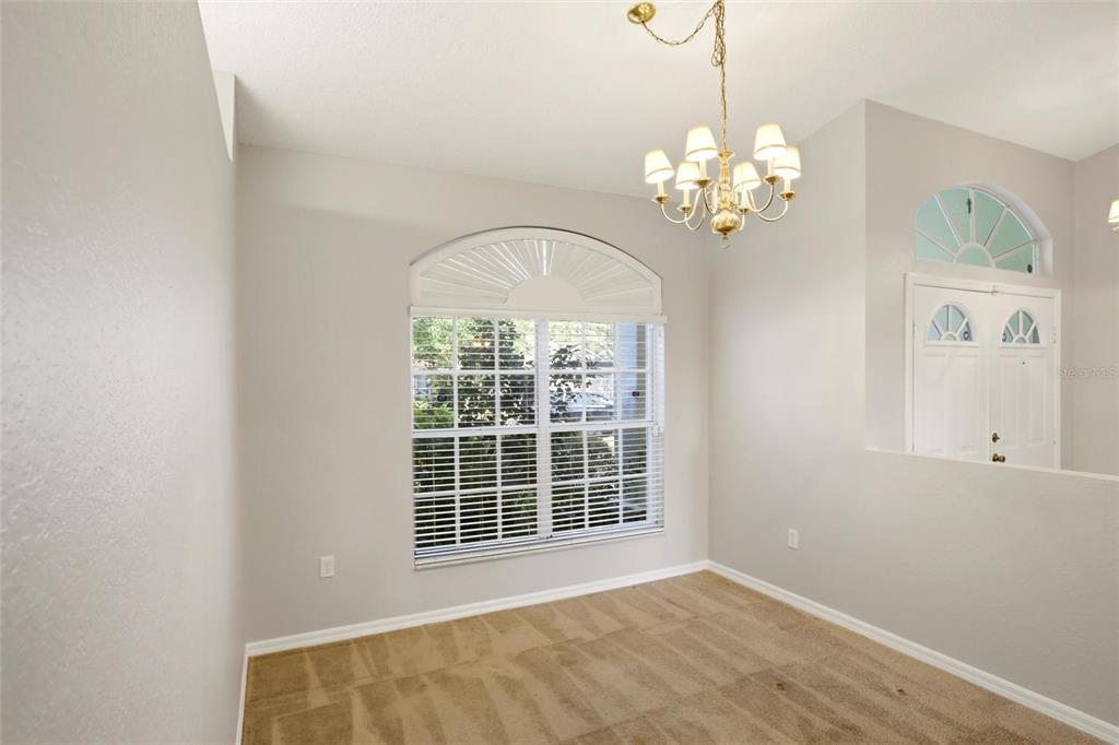 24644 Laurel Ridge Drive Lutz, FL 33559 - Photo 14 of 42 a view of an empty room with a window