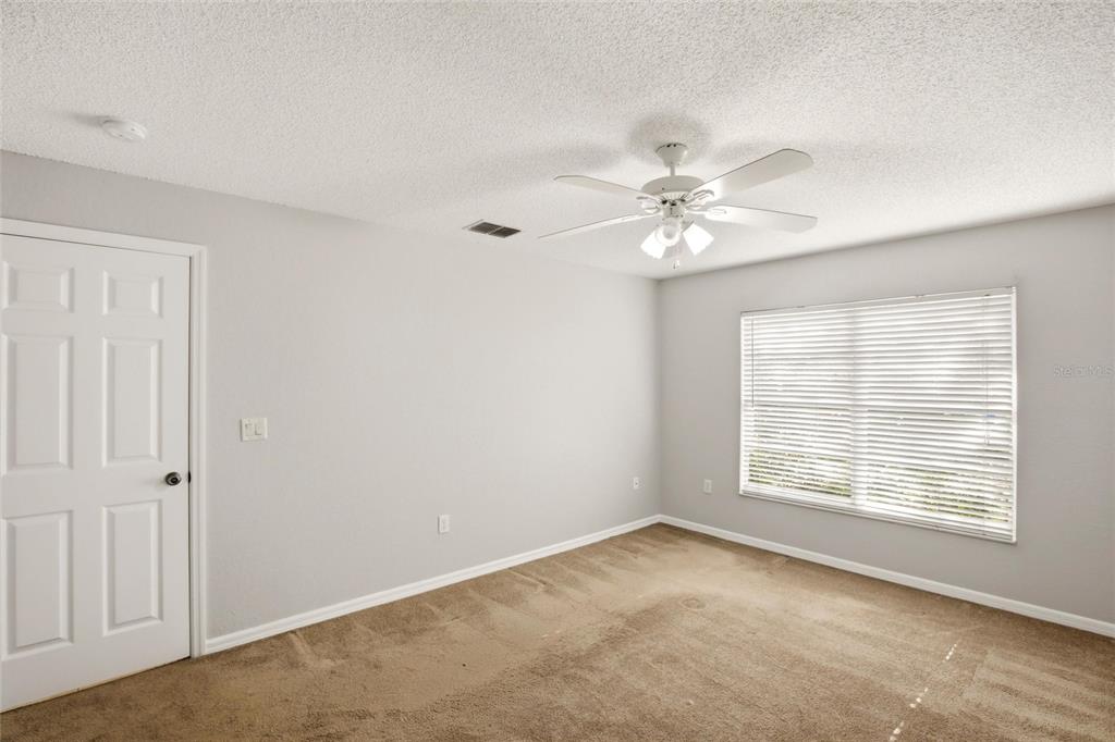24644 Laurel Ridge Drive Lutz, FL 33559 - Photo 19 of 42 a view of an empty room with a window