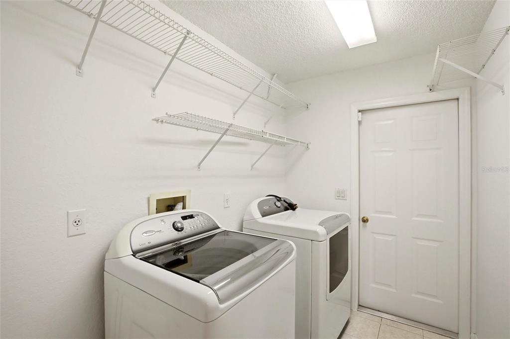 24644 Laurel Ridge Drive Lutz, FL 33559 - Photo 33 of 42 a utility room with dryer and washer