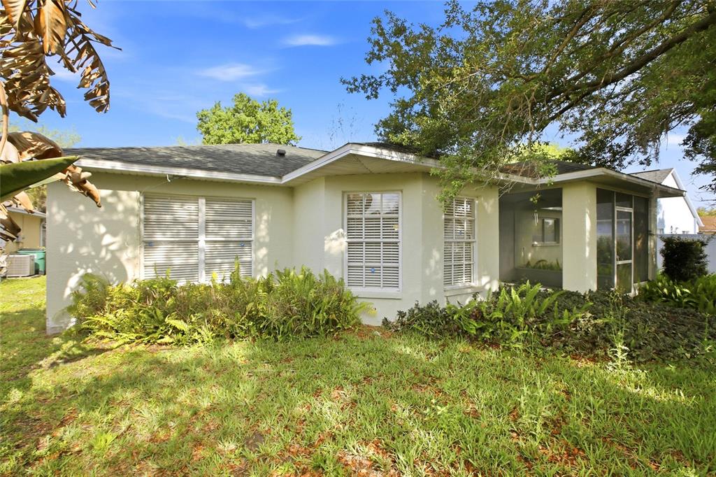 24644 Laurel Ridge Drive Lutz, FL 33559 - Photo 34 of 42 a front view of a house with a yard