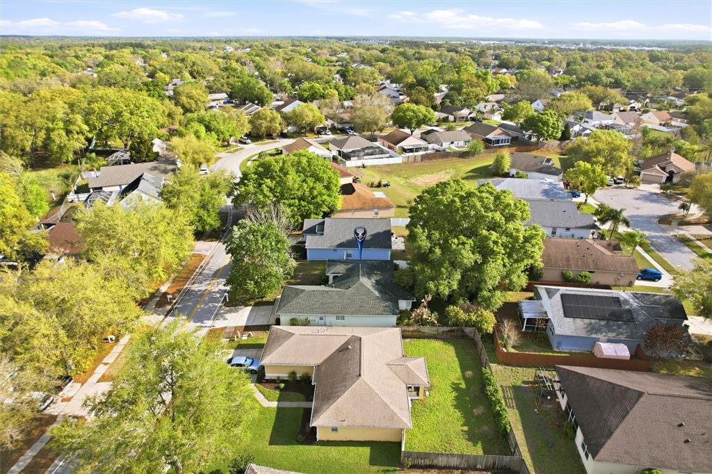 24644 Laurel Ridge Drive Lutz, FL 33559 - Photo 38 of 42 an aerial view of residential houses with outdoor space and parking