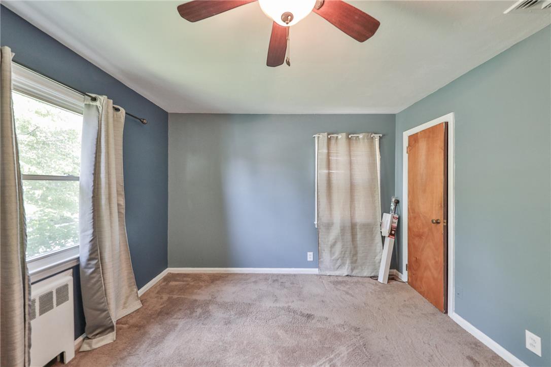 3050 Cornwall Road Bethlehem, PA 18017 - Photo 31 of 80 A well-lit bedroom features plush carpeting and a convenient ceiling fan for comfort.