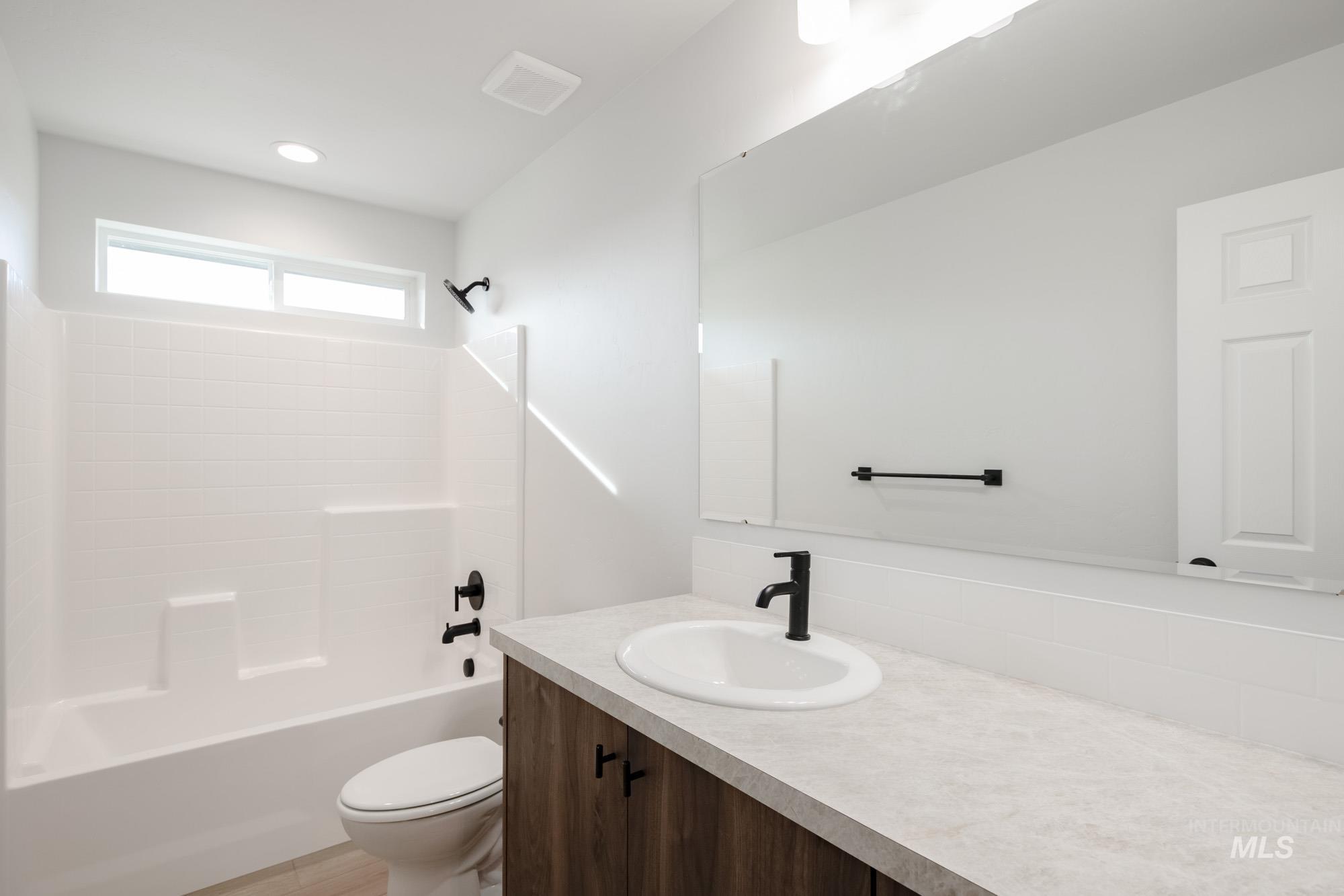 13697 Inman Court Caldwell, ID 83607 - Photo 19 of 23 Bathroom featuring vanity and bathing tub / shower combination