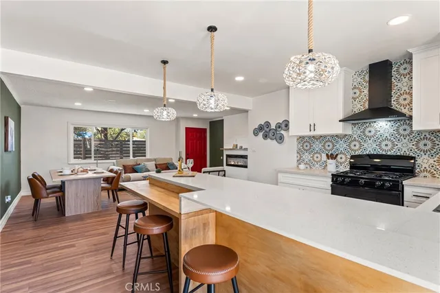a kitchen with a table and chairs in it