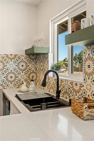 a view of sink and mirror