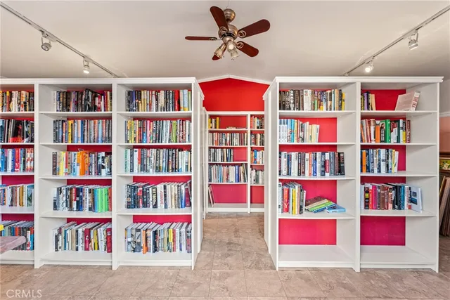 a workspace with an lots of book shelf