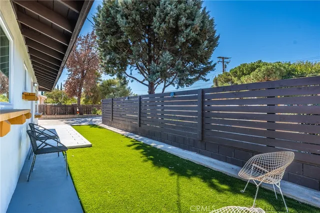 a view of a yard with furniture