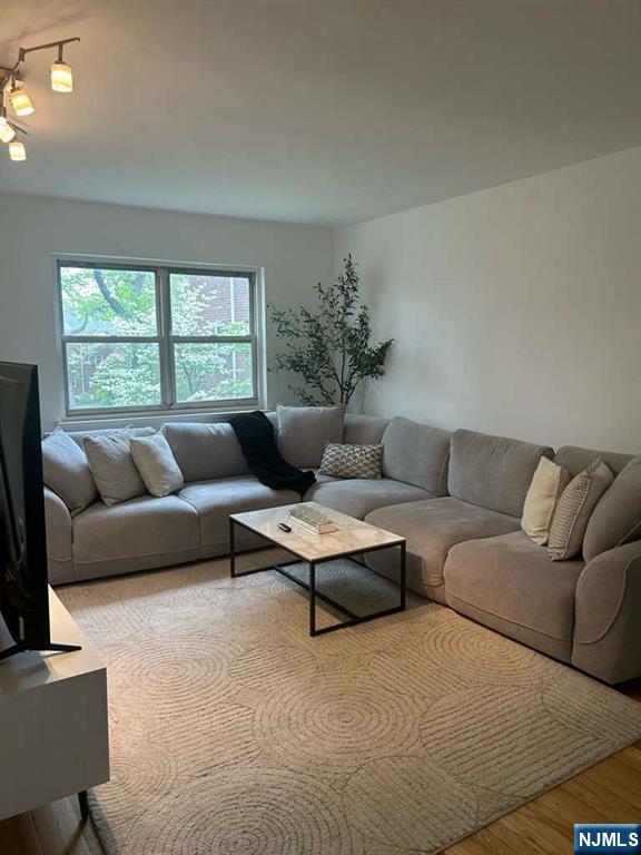 1480 Terrace, Unit 4 Teaneck, NJ 07666 - Photo 1 of 14 a living room with furniture and a large window