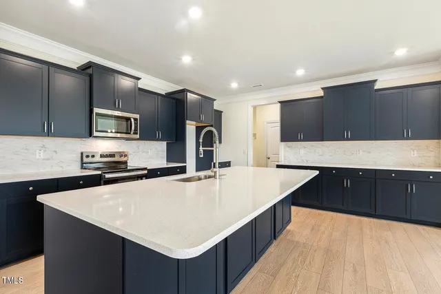 a kitchen with a sink and a fireplace