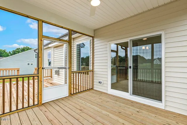 a view of a kitchen with a dishwasher and wooden floor