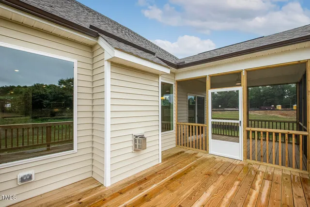 a view of house with backyard and pool