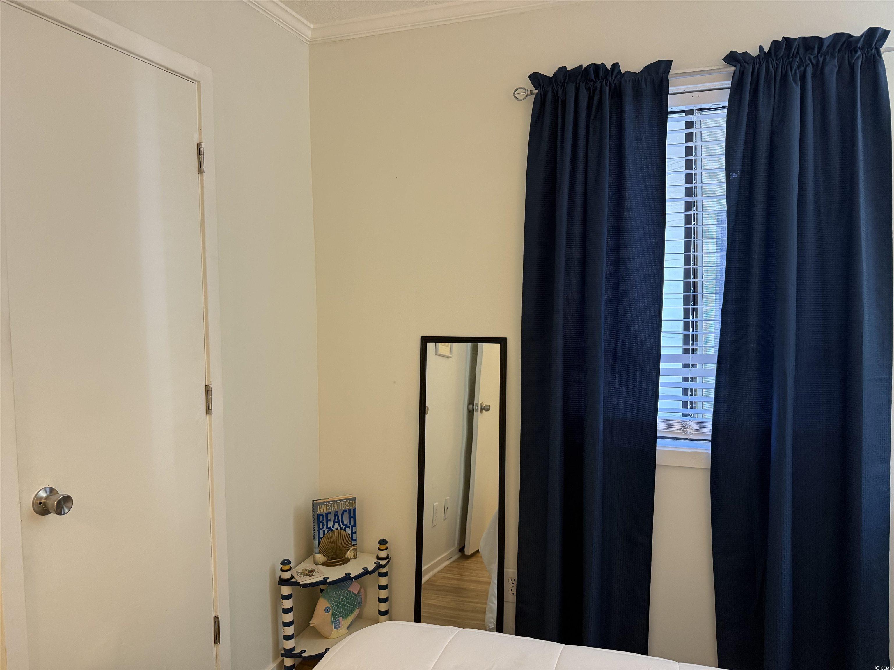 4350 Intercoastal Drive, Unit INTERCOASTAL VILLAGE UNI Little River, SC 29566 - Photo 15 of 21 Bedroom with crown molding