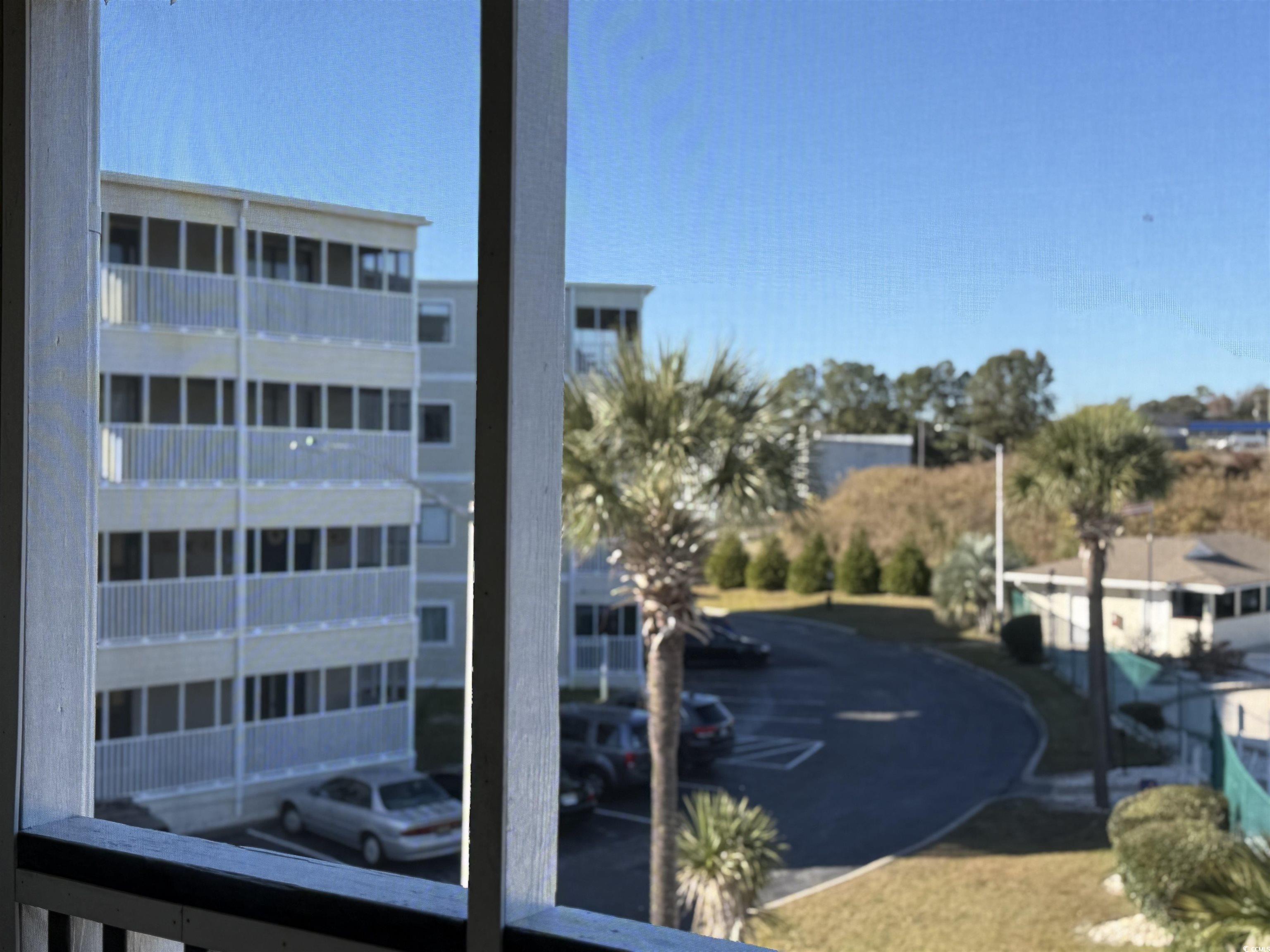4350 Intercoastal Drive, Unit INTERCOASTAL VILLAGE UNI Little River, SC 29566 - Photo 2 of 21 View of apartment building / complex featuring uncovered parking