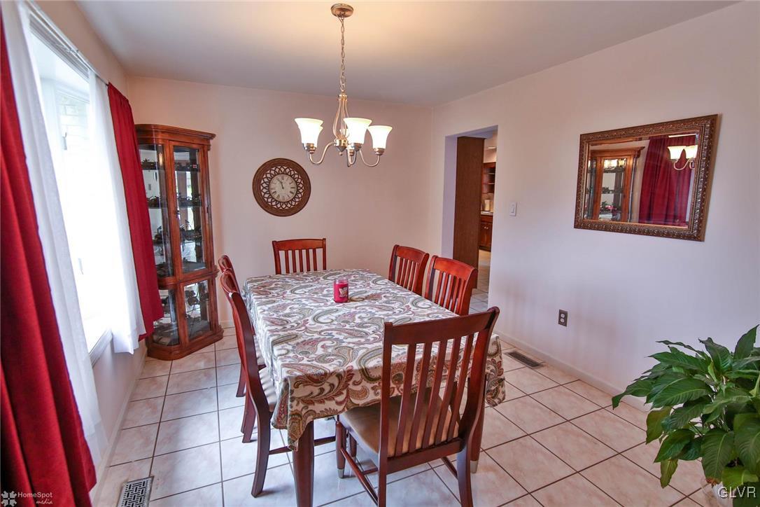 3056 Glendon Road Bethlehem, PA 18017 - Photo 8 of 22 a view of a dining room with furniture wooden floor and a chandelier