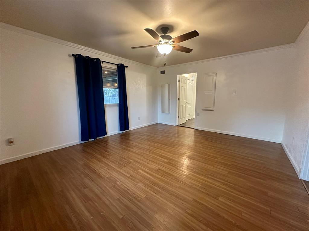 2734 Mildred Street Waco, TX 76706 - Photo 12 of 32 Master Bedroom featuring ornamental molding, wood finished floors, and a ceiling fan