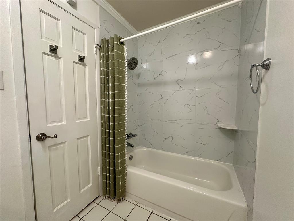 2734 Mildred Street Waco, TX 76706 - Photo 21 of 32 Upstairs bathroom with shower / tub combo and light tile patterned flooring