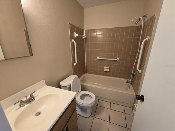 a bathroom with a sink a toilet and a bathtub