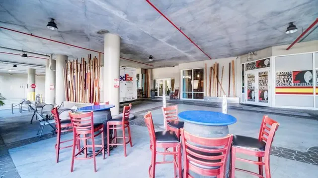 a dining room with furniture and window