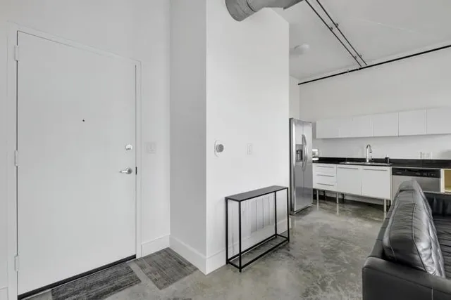 a view of a kitchen with appliances and cabinets