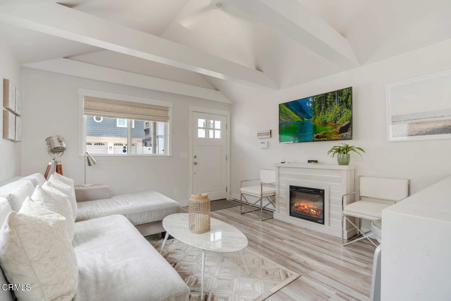 3534 Ocean Drive Oxnard, CA 93035 - Photo 12 of 47 a living room with furniture a flat screen tv and a fireplace