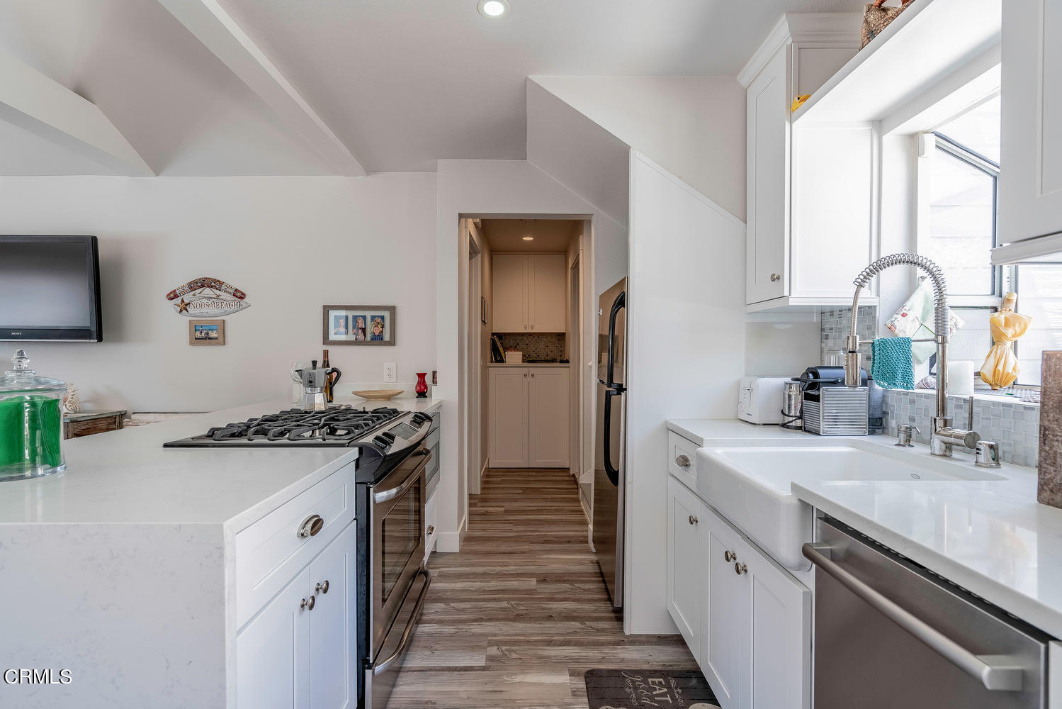 3534 Ocean Drive Oxnard, CA 93035 - Photo 15 of 47 a kitchen with a sink stove and refrigerator
