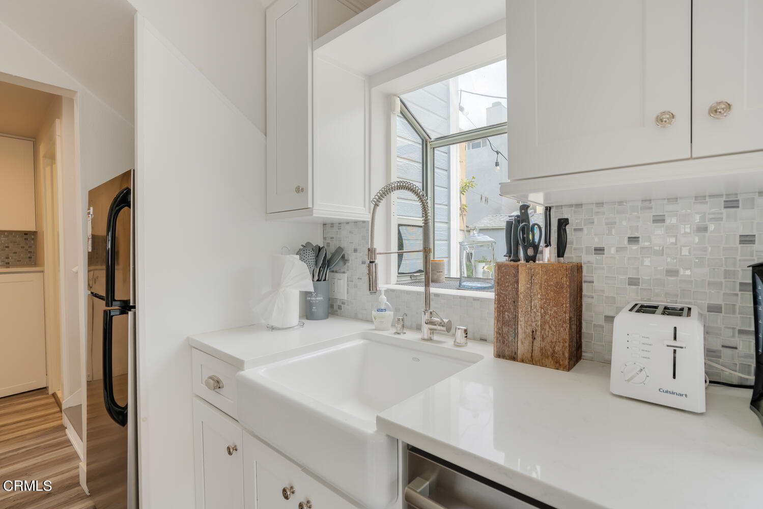 3534 Ocean Drive Oxnard, CA 93035 - Photo 16 of 47 a kitchen with stainless steel appliances a sink and a refrigerator