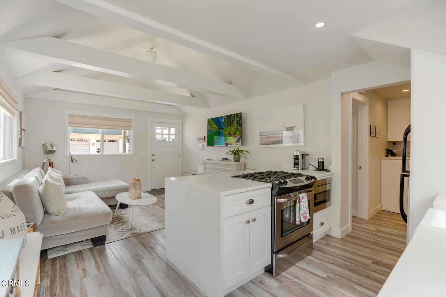 3534 Ocean Drive Oxnard, CA 93035 - Photo 18 of 47 a kitchen with stainless steel appliances granite countertop a stove and a refrigerator
