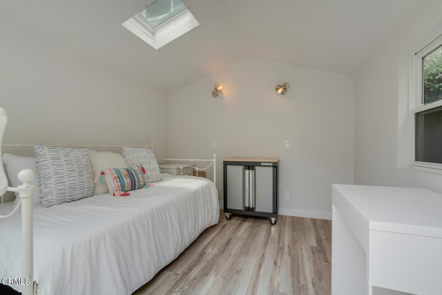 3534 Ocean Drive Oxnard, CA 93035 - Photo 30 of 47 a bedroom with a bed and a table