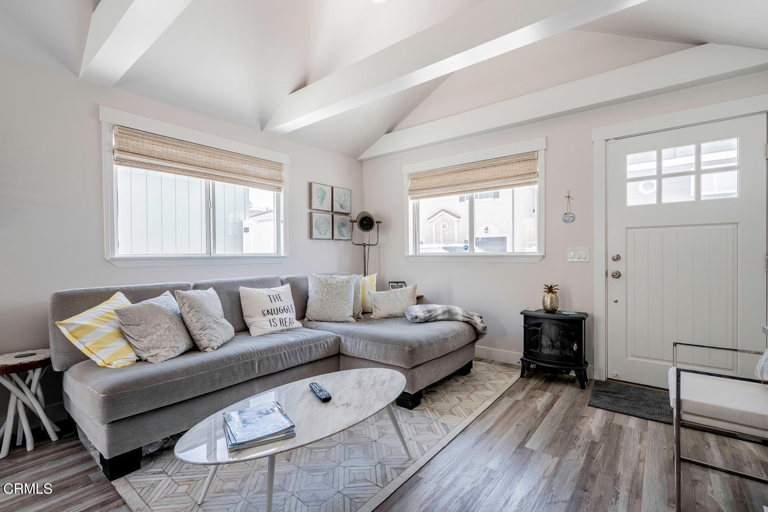 3534 Ocean Drive Oxnard, CA 93035 - Photo 9 of 47 a living room with furniture and a wooden floor