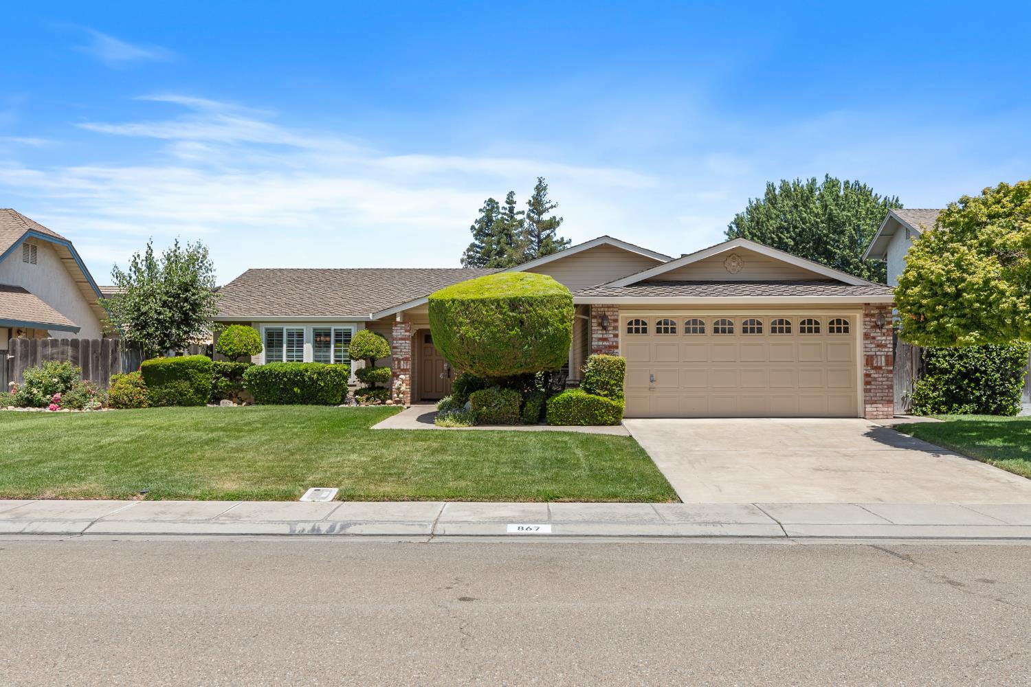 867 Jordanolo Drive Ripon, CA 95366 - Photo 1 of 1 a front view of a house with a yard and garage