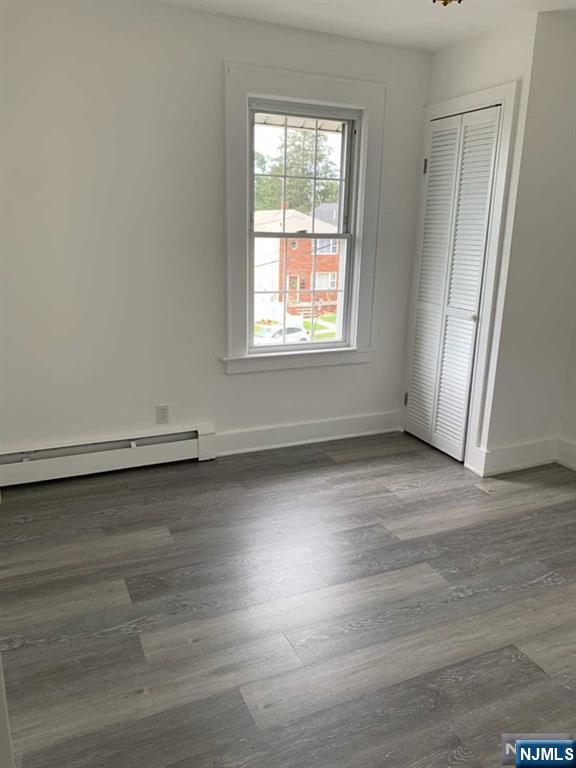 73 East Gouverneur Avenue Rutherford, NJ 07070 - Photo 19 of 33 an empty room with wooden floor and windows
