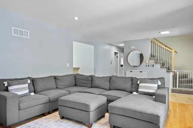 a living room with couches and a couches