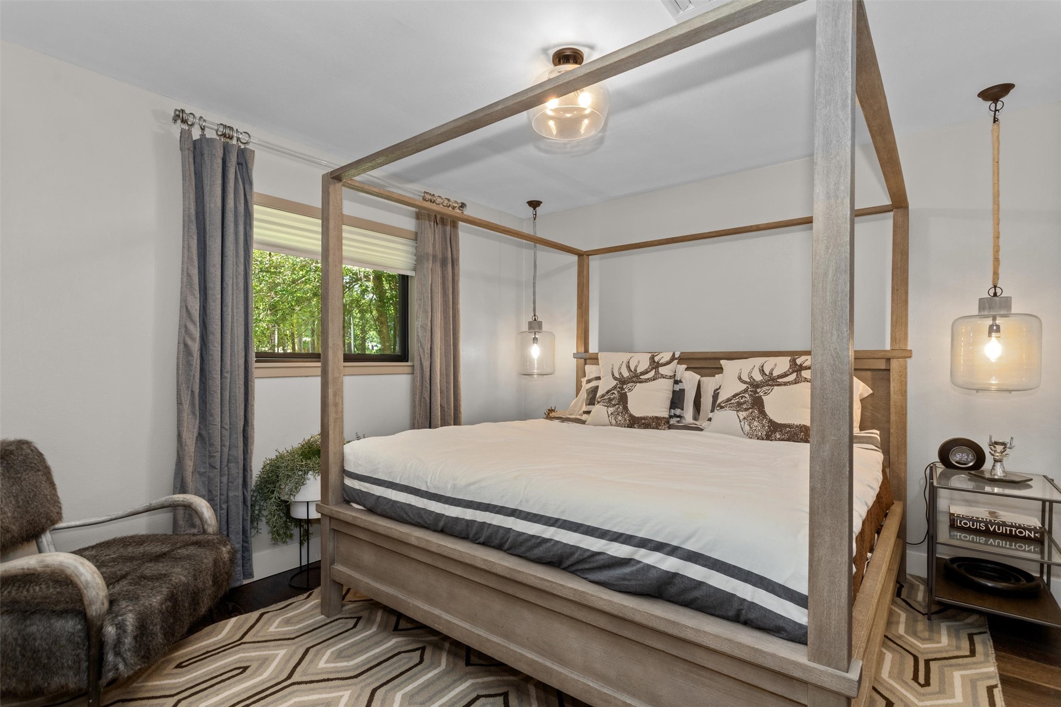 678 Sawmill Road Crockett, TX 75835 - Photo 20 of 29 a bedroom with a bed wooden floor and window